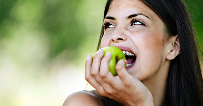 Active8me 7 simple ways reduce food waste woman eating whole green apple